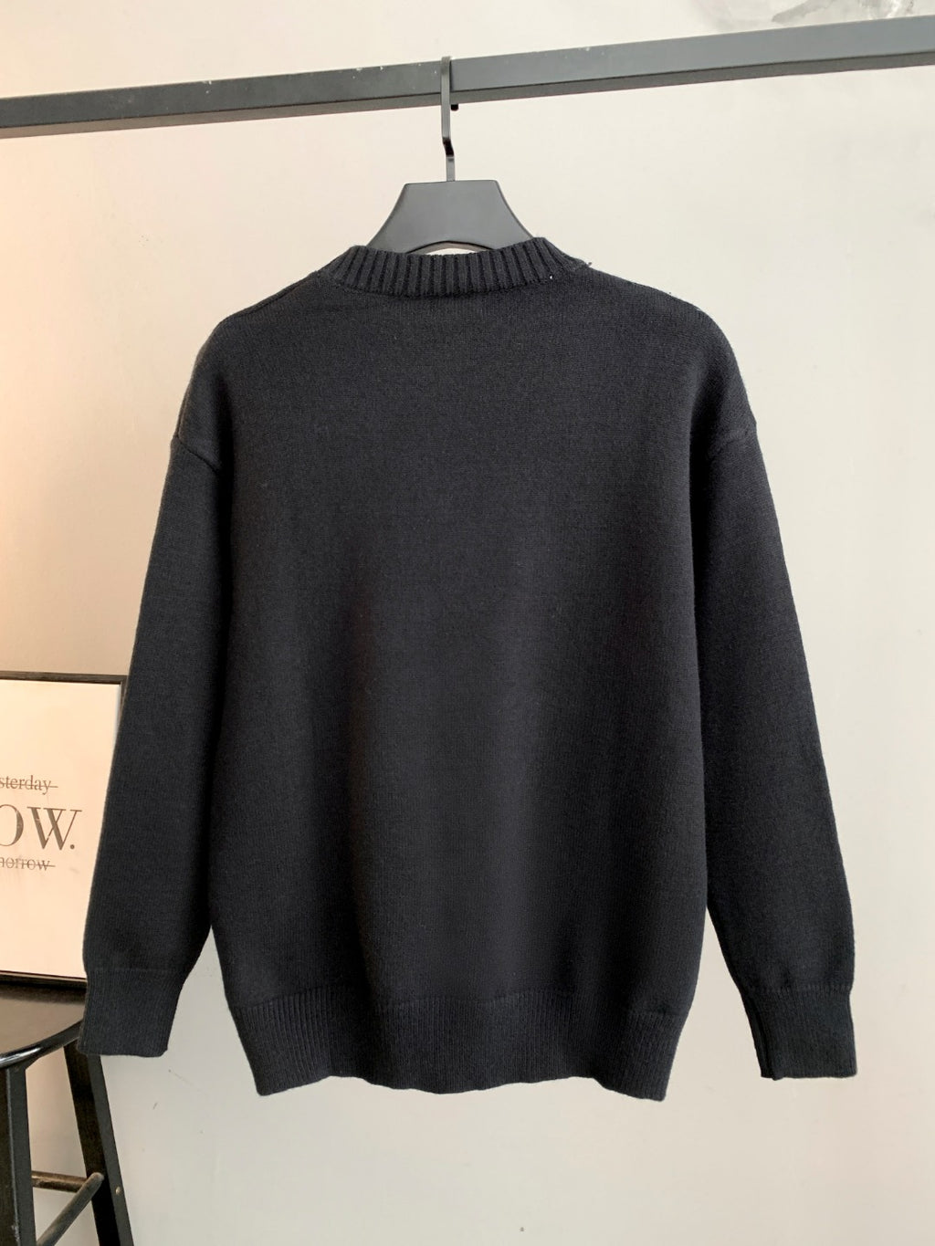 Black Fendi crewneck sweater back view on hanger