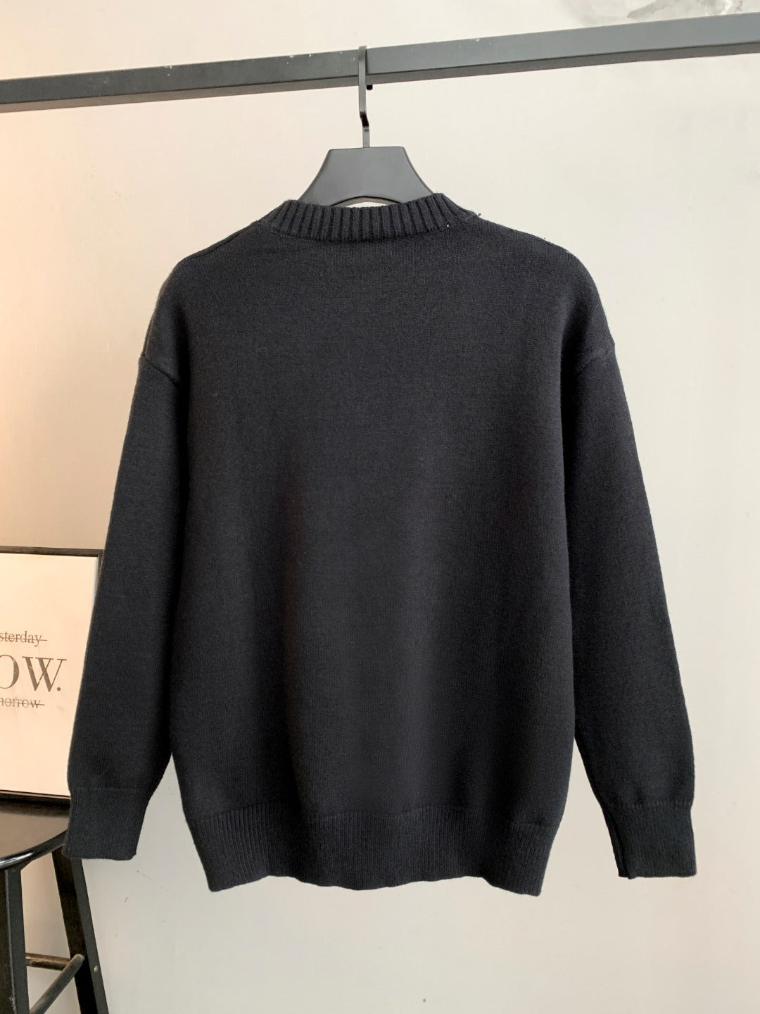 Black Fendi crewneck sweater back view on hanger
