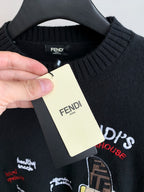 Black Fendi crewneck sweater neckline with hanging fabric tag and ribbed collar