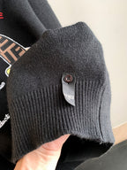 Black Fendi sweater ribbed cuff with round button and brand patch