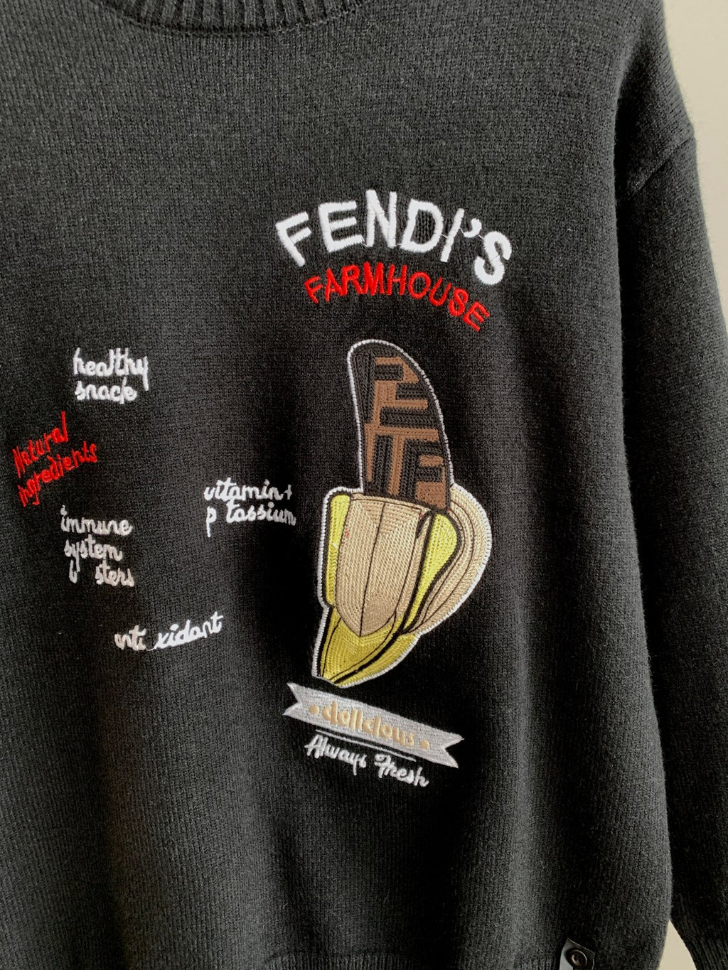 Black Fendi crewneck sweater with Farmhouse-style cartoon graphic on chest