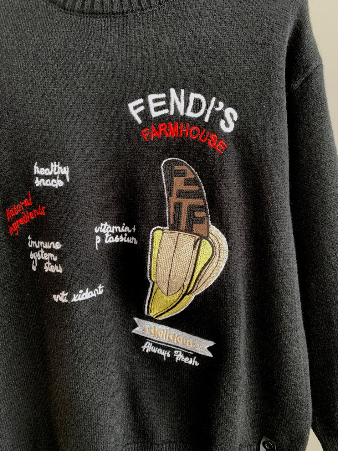 Black Fendi crewneck sweater with Farmhouse-style cartoon graphic on chest