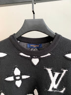 Black knit sweater neckline with ribbed crew collar and Louis Vuitton brand label