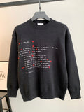 Dark charcoal knit crewneck sweater with red heart and script graphic at center