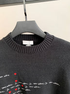 Dark charcoal sweater with ribbed crewneck and embroidered-style red heart script detail