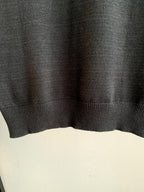Dark charcoal knit sweater hem with ribbed bottom band