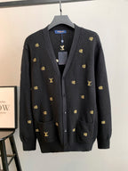Dark knit cardigan with V-neck, button front, gold monogram pattern, patch pockets