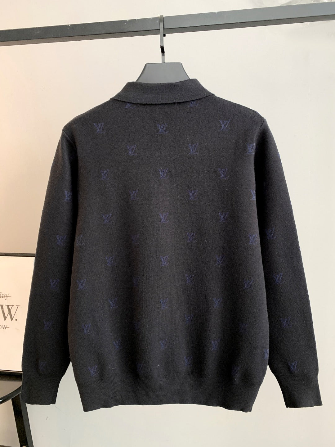 Long-sleeve polo sweater in dark gray with blue monogram pattern, back view