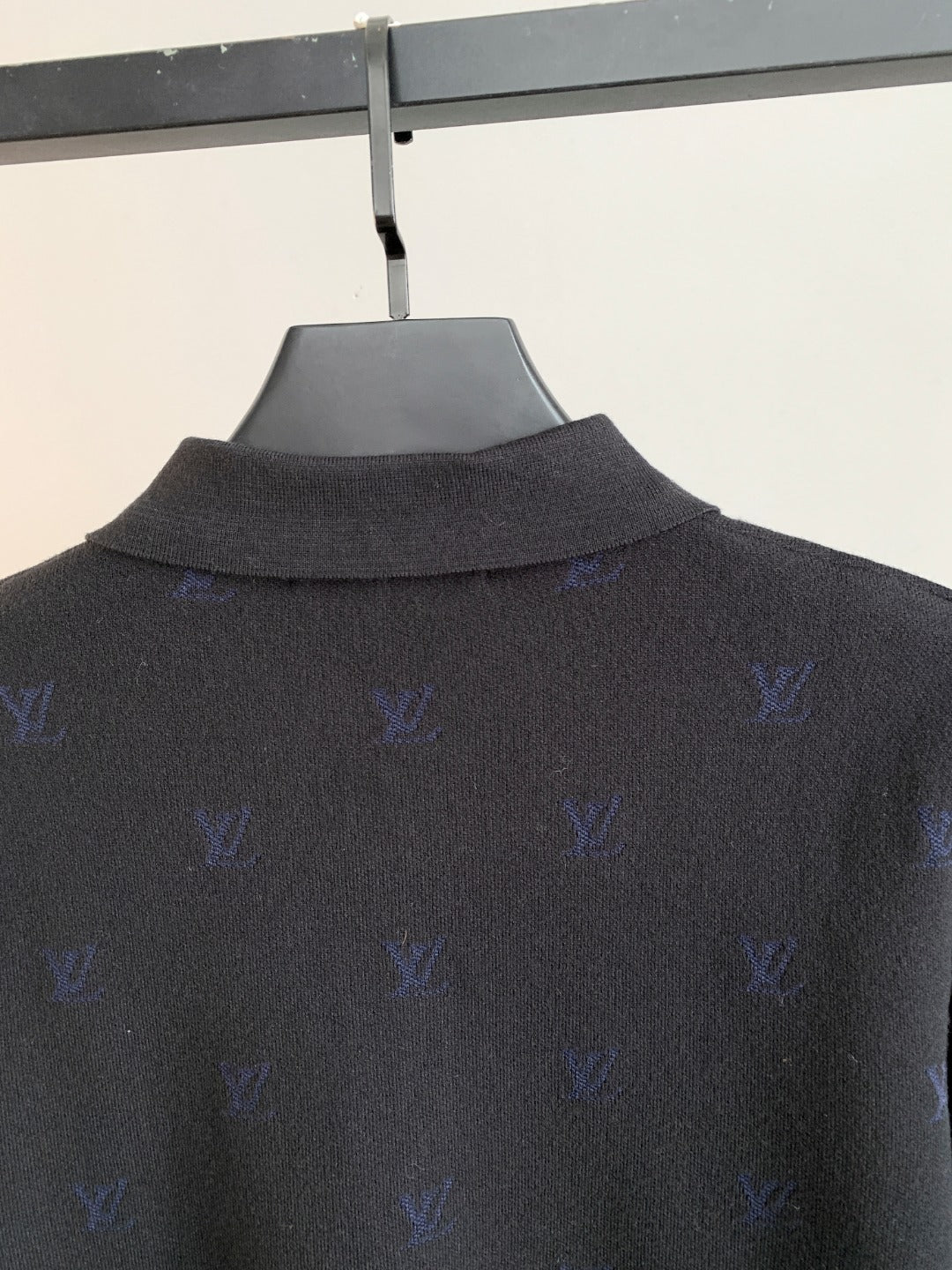 Long-sleeve polo sweater collar and upper back in dark gray with blue monogram