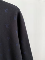 Long-sleeve polo shoulder and sleeve in dark gray with scattered blue monogram