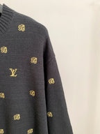 Long-sleeve knit sweater sleeve with gold monogram and LV logo detail.