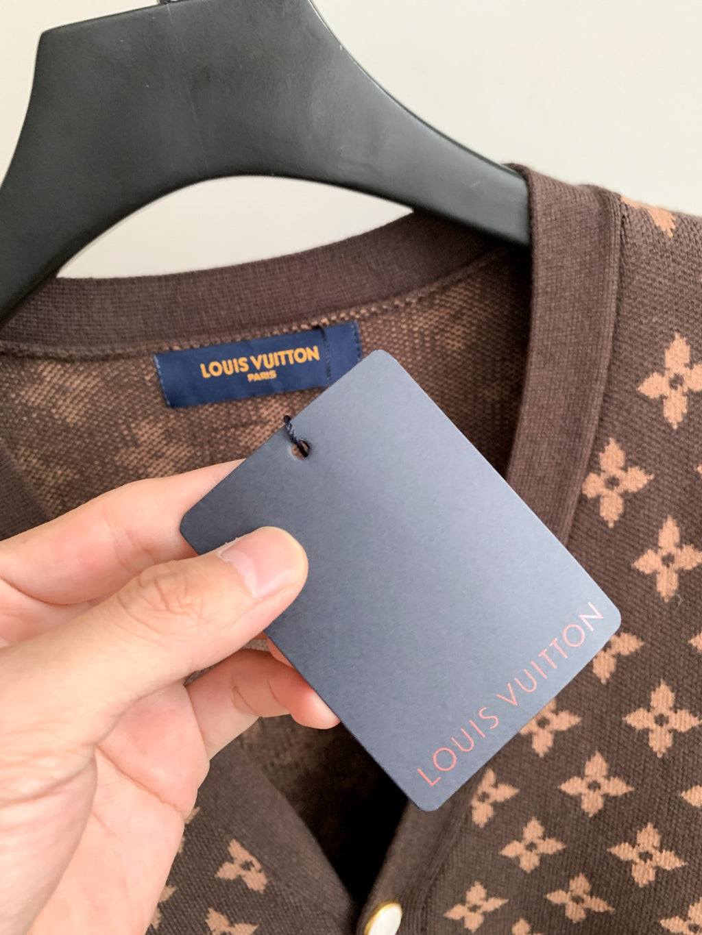 Brown monogram cardigan neckline with attached hang tag