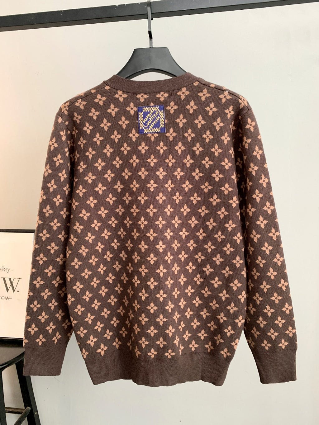 Brown monogram knit cardigan with long sleeves and button front