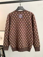 Brown monogram knit cardigan with long sleeves and button front