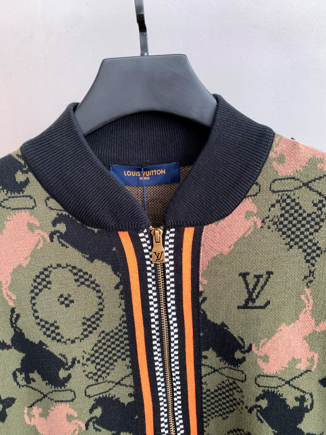 Louis Vuitton zip-up jacket neck, ribbed collar, orange striped zipper detail