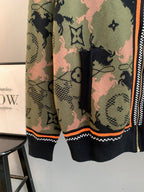 Louis Vuitton zip-up jacket hem view, dark ribbed trim and orange piping, monogram camo