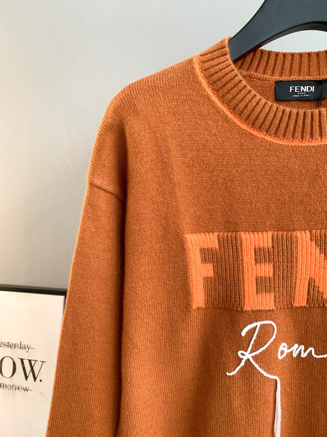 Fendi orange sweater front with FENDI Roma lettering and ribbed trim