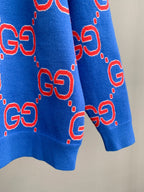 Blue knit sweater with red GG pattern all over, ribbed hem and cuffs