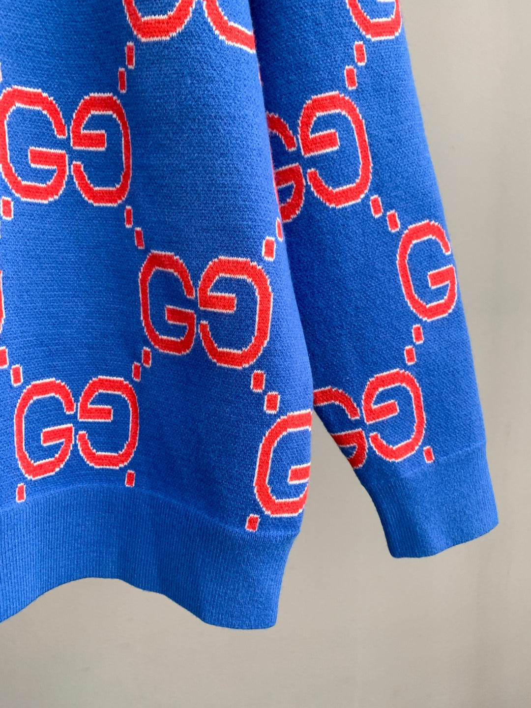 Blue knit sweater with red GG pattern all over, ribbed hem and cuffs