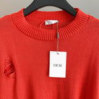 Dior red knit sweater neckline with ribbed collar and Dior hang tag