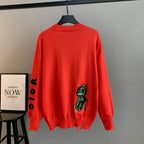 Dior red knit sweater with back dinosaur graphic and distressed holes