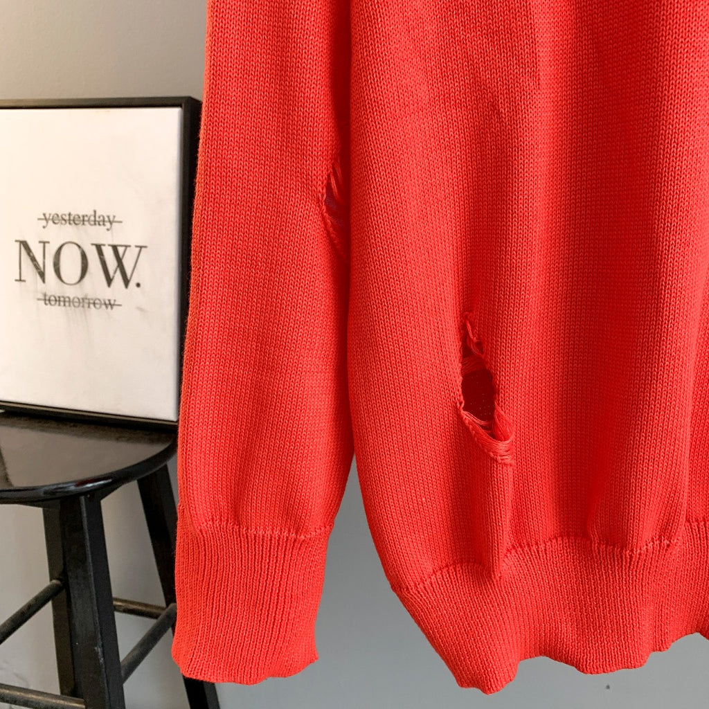 Dior red knit sweater lower hem with distressed opening at side