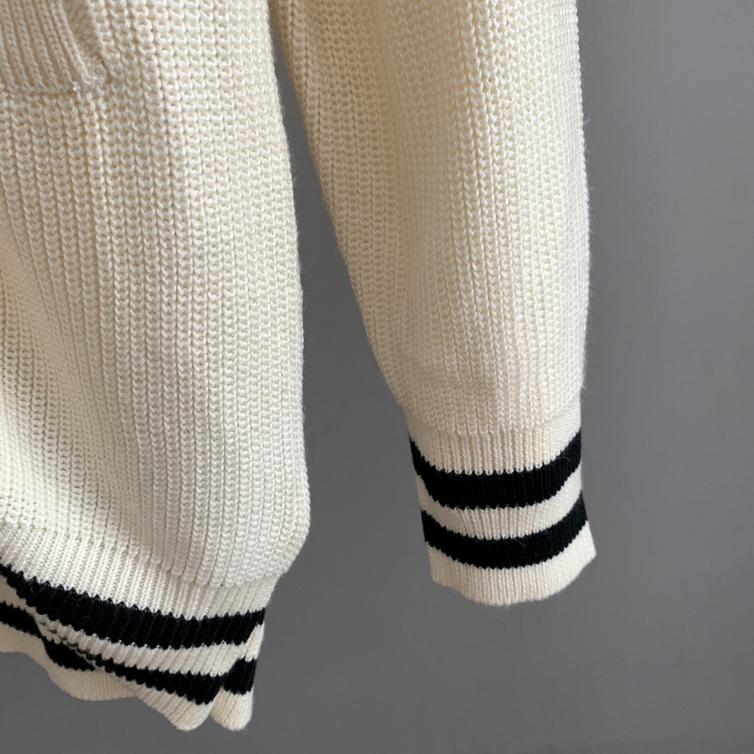 Ivory knit cardigan hem and sleeve cuff with black ribbed stripes