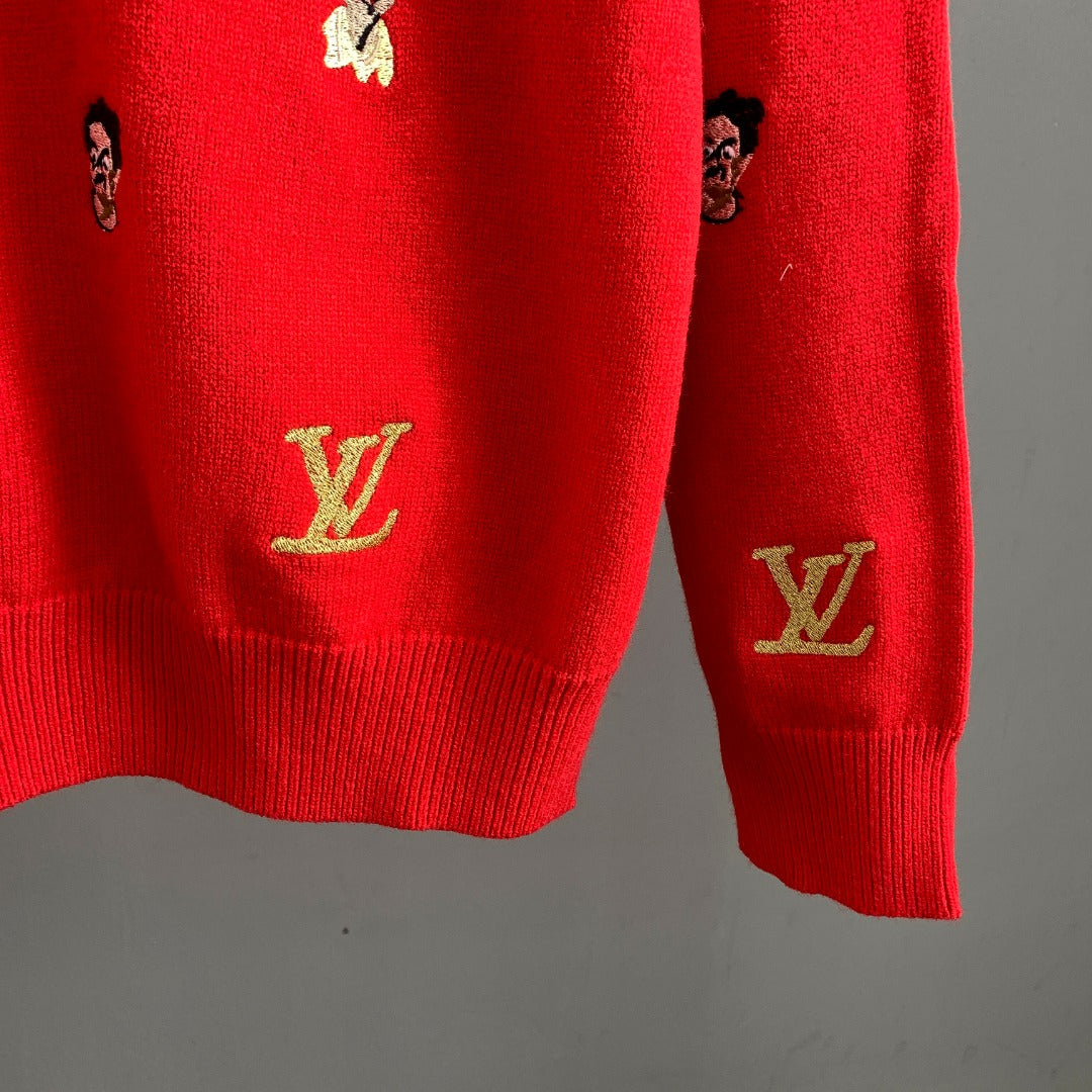 Red knit sweater hem and sleeve cuff with embroidered Louis Vuitton logo on sleeve
