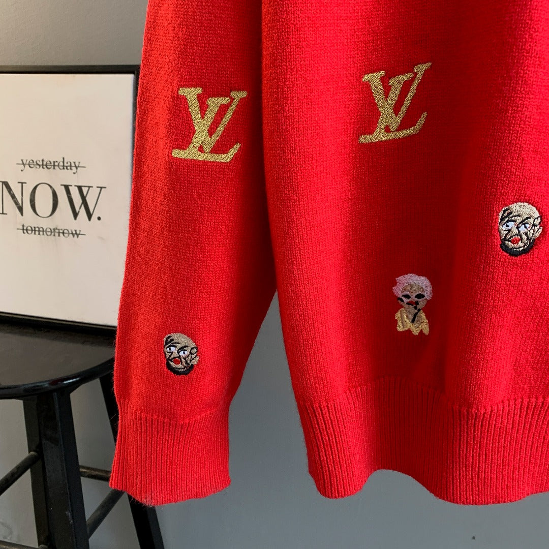 Red sweater lower sleeves with embroidered face patches and gold Louis Vuitton logos