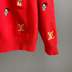 Red sweater back hem and sleeve cuff with Louis Vuitton logos embroidered