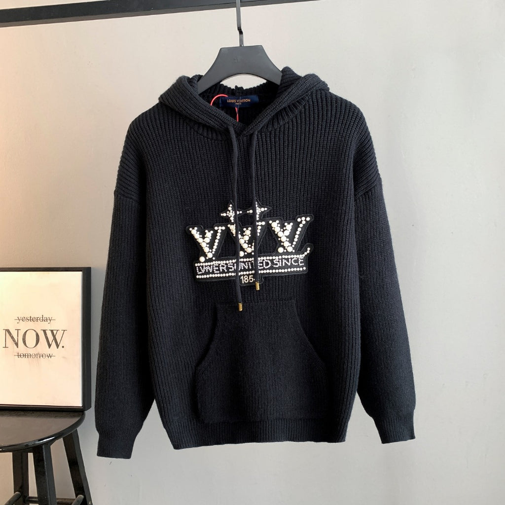 Hooded knit sweater with dark zip front and rhinestone logo graphic on chest