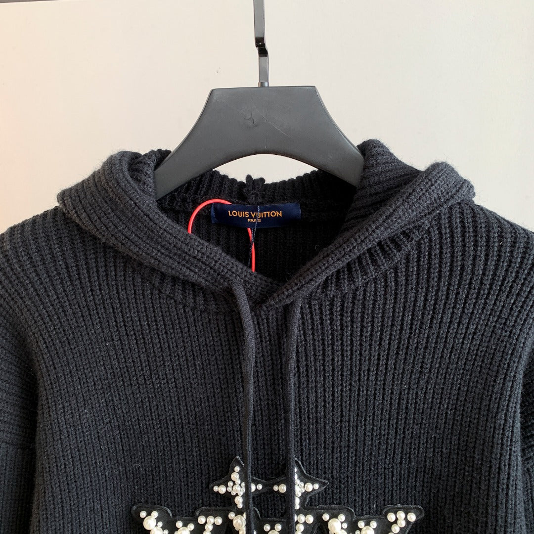 Hooded knit sweater with textured ribbed knit and rhinestone cross logo on chest