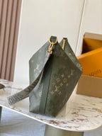 Louis Vuitton monogram hobo bag with wide top handle, dark green trim, gold hardware