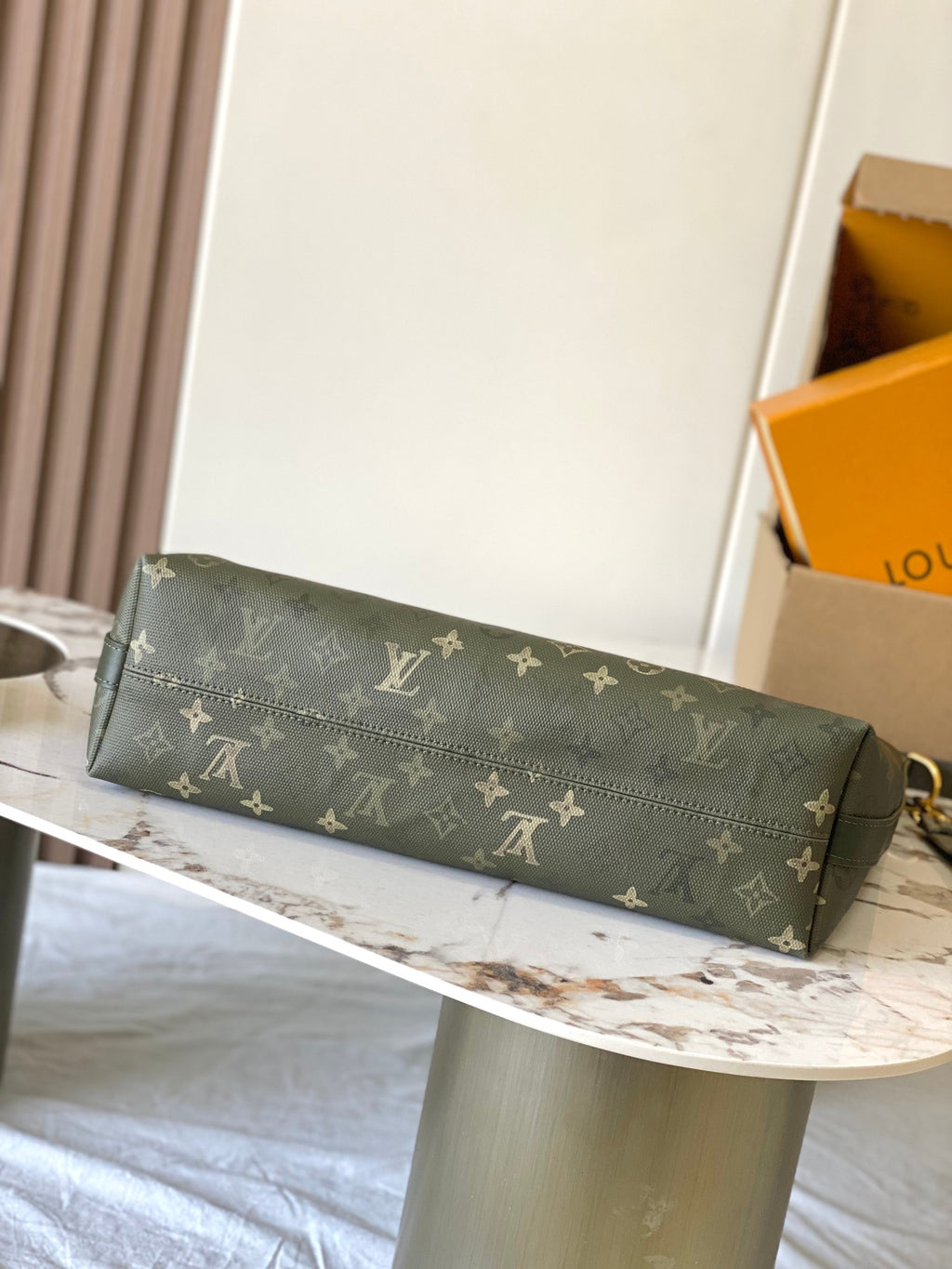 Louis Vuitton monogram pouch bag in dark green with long strap and gold-tone clasp
