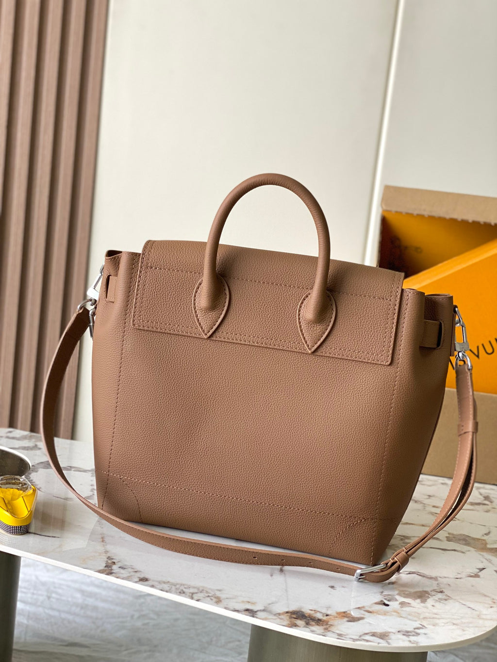 Louis Vuitton tan leather tote bag with top handles and front flap
