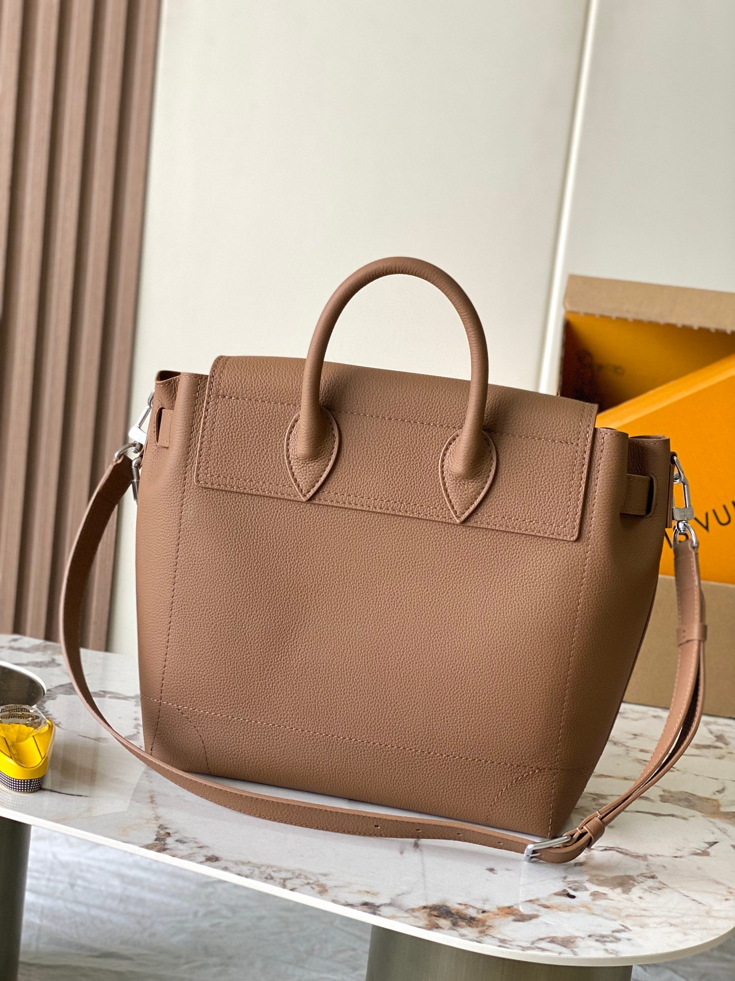 Louis Vuitton tan leather tote bag with top handles and front flap