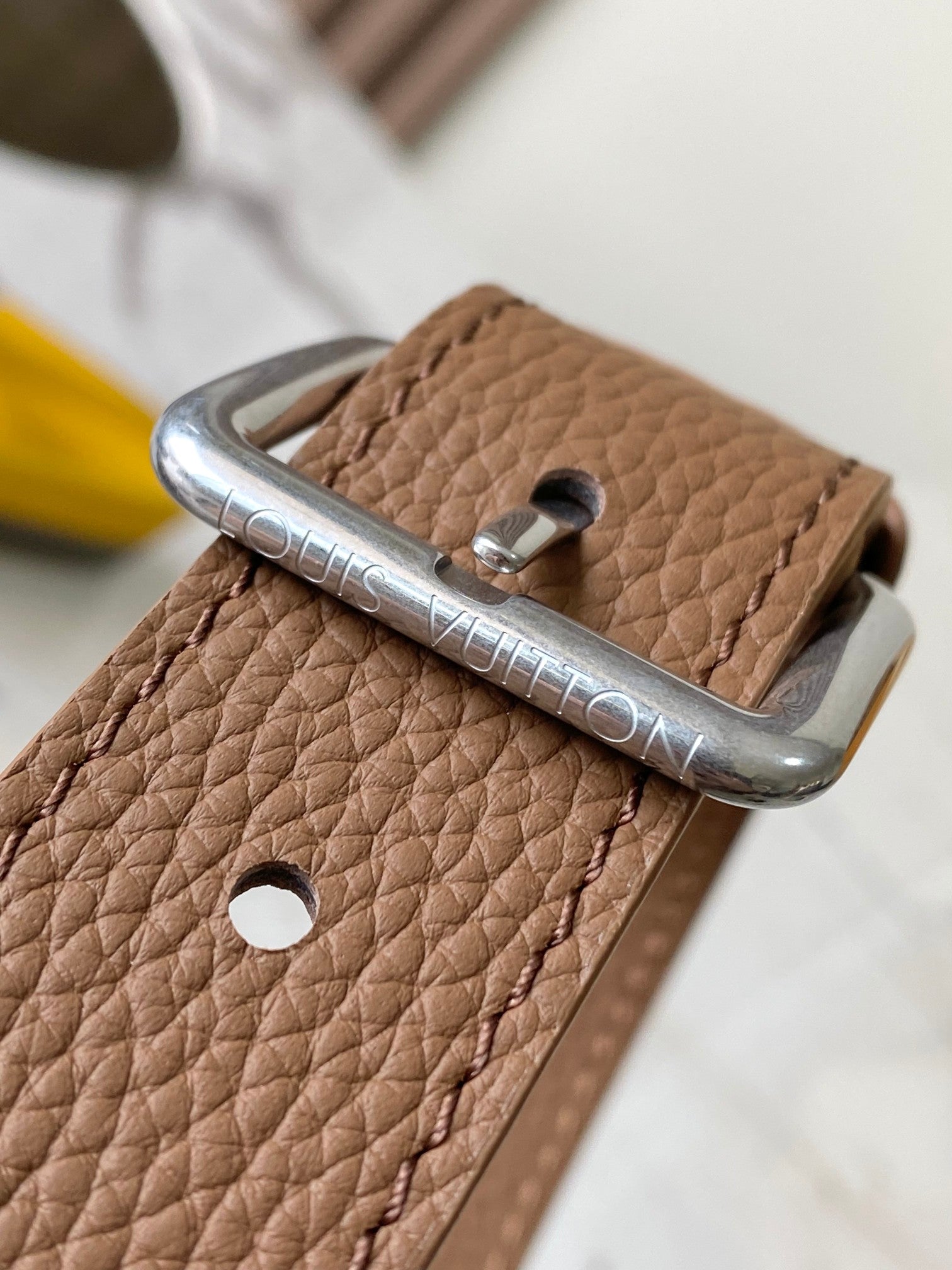 Louis Vuitton tan leather strap end with metal buckle ring and rivet detail