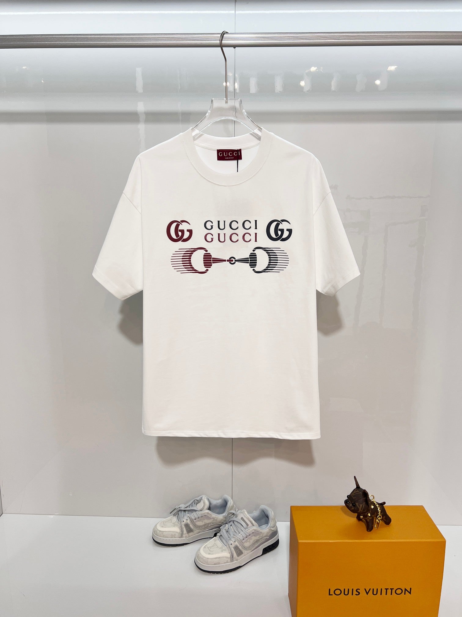 White Gucci crewneck T-shirt with front Gucci logo graphic, short sleeves