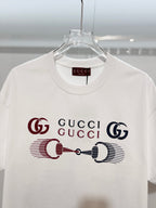 White Gucci crewneck T-shirt with front graphic Gucci logo, close-up