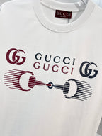 White Gucci crewneck T-shirt with front logo graphic in red and navy, close-up