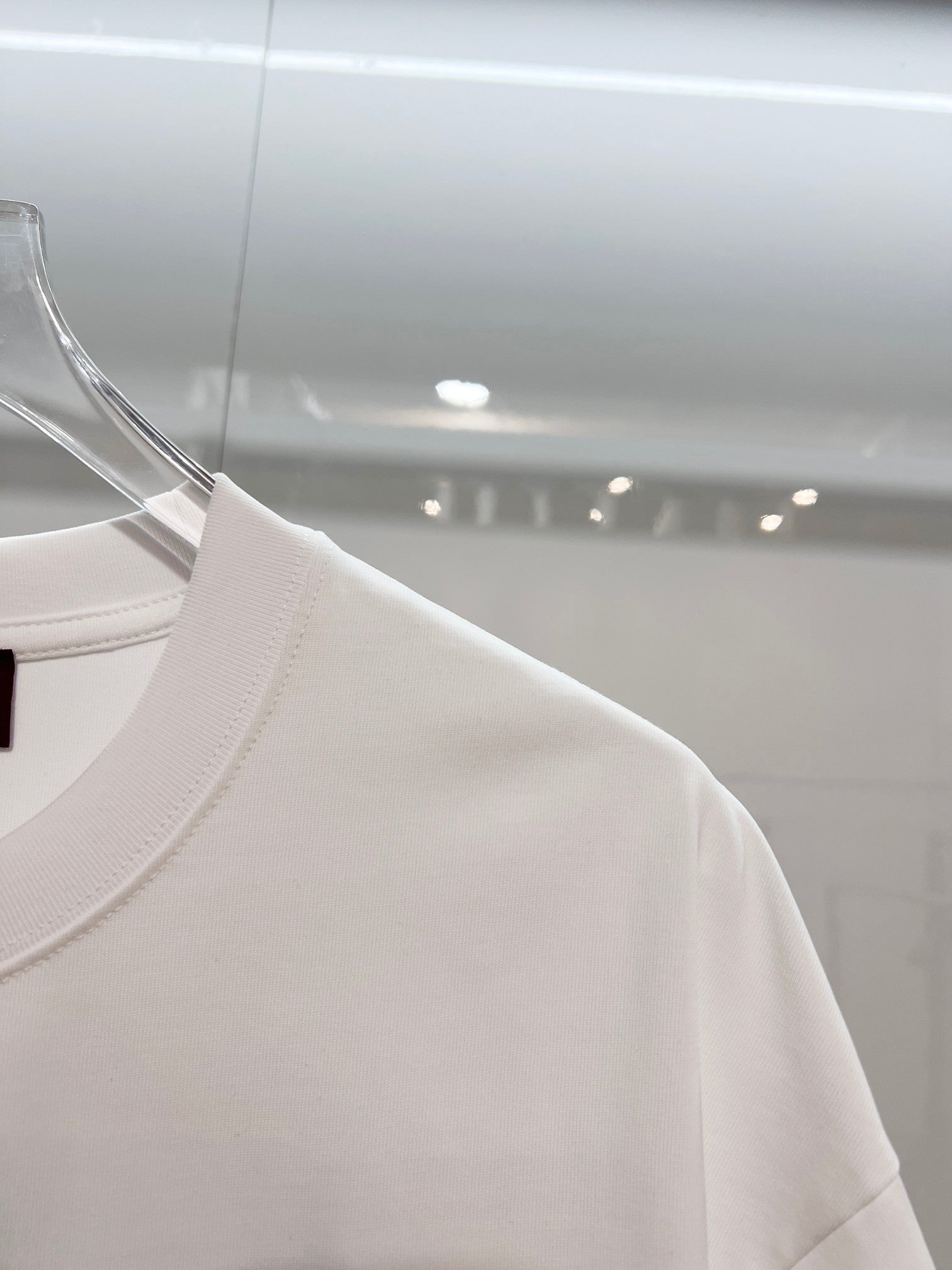 White Gucci T-shirt sleeve and shoulder seam, side view