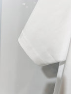 White Gucci T-shirt hem and side seam detail, close-up