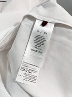 Gucci T-shirt inside neck label and care tag, close-up