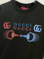 Black Gucci T-shirt front close-up showing GG and colorful horse-bit graphic