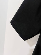 Black Gucci T-shirt sleeve hem with visible stitching