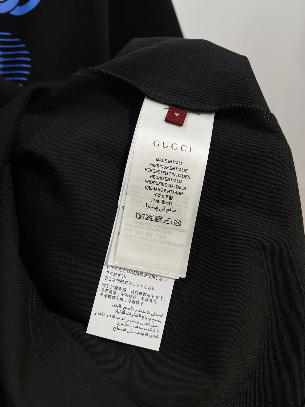 Black Gucci T-shirt back neck label with size and care tags