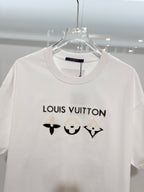 White Louis Vuitton T-shirt with black logo text and chest icons, close-up