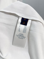White T-shirt size label inside collar with sizing and care text