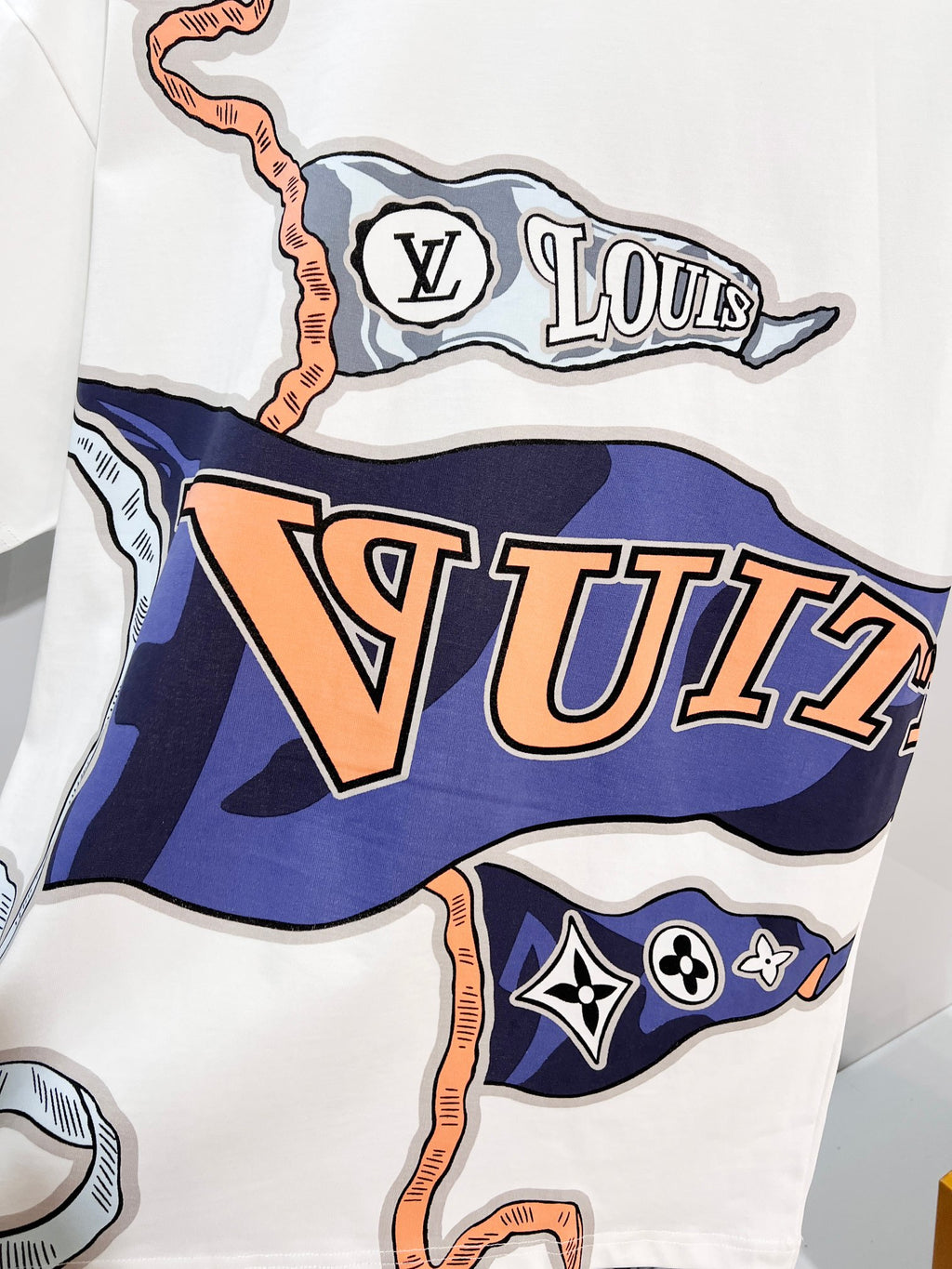 White Louis Vuitton T-shirt close-up of large colorful 'VUI' graphic print