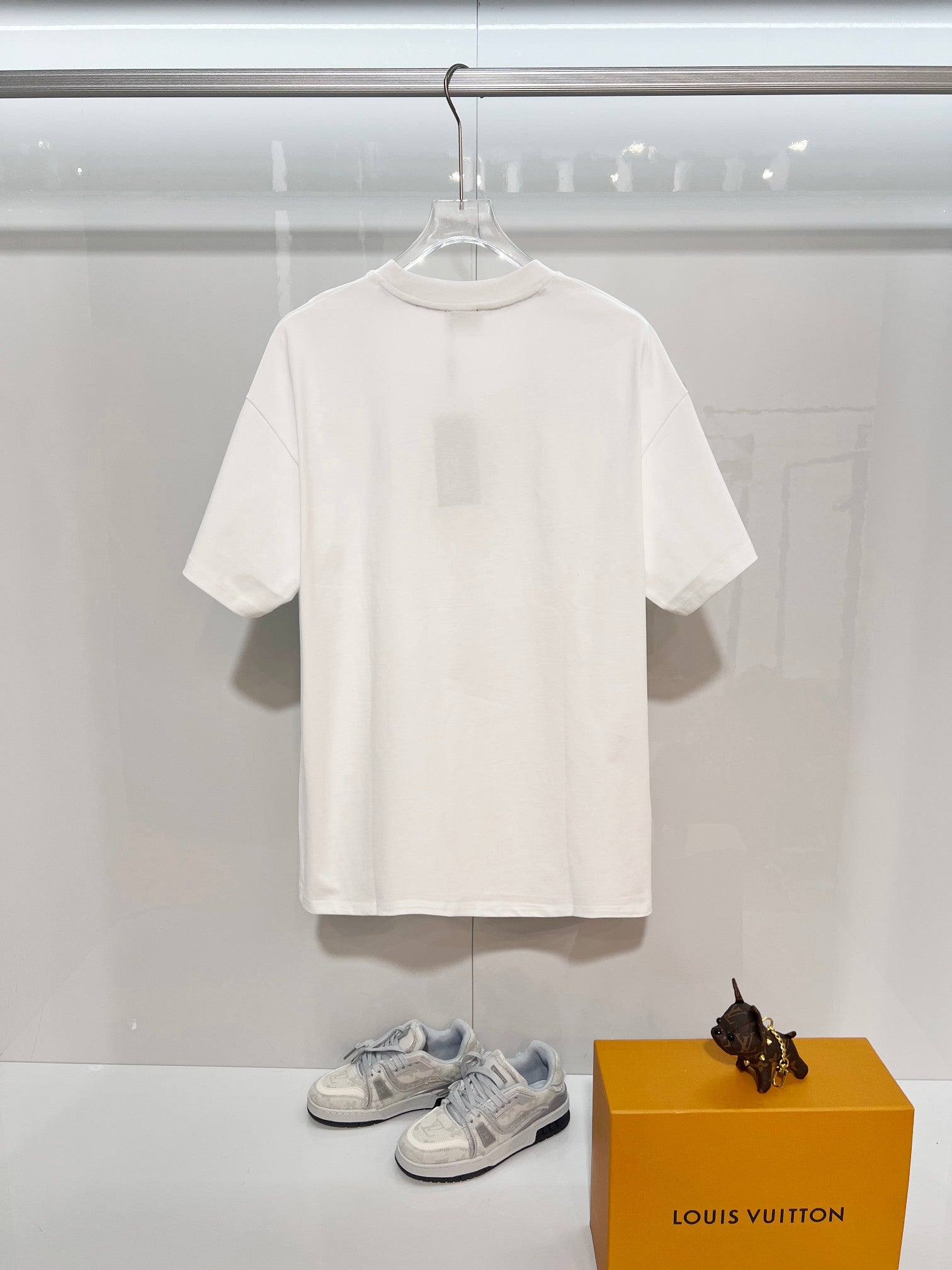 Fendi white short-sleeve T-shirt on a hanger, plain front